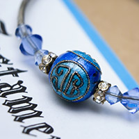 Blue braclet on a white background