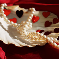 Pearl Necklace on a red and white background